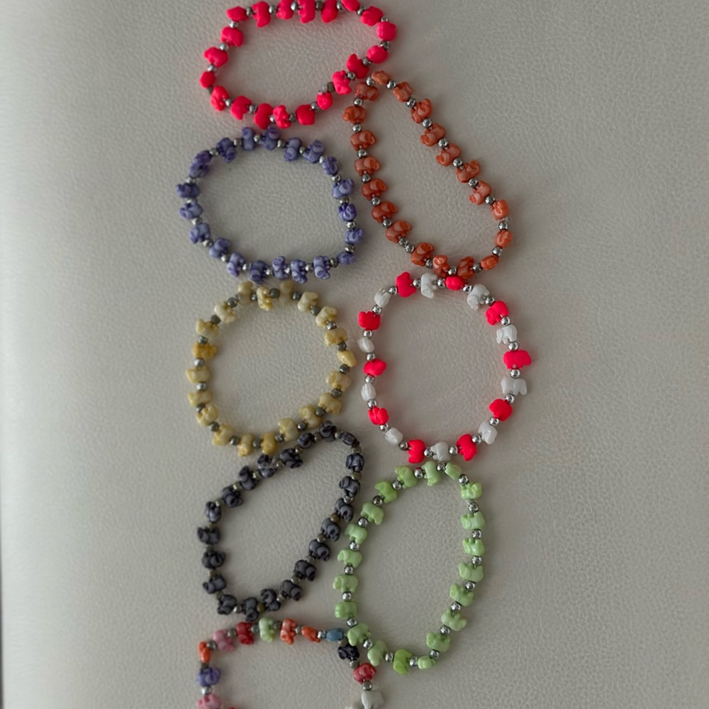 Set of 8 multicolored elephant bracelets with trunk up